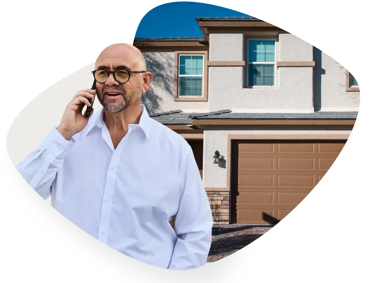 Noah on phone with a house in the background